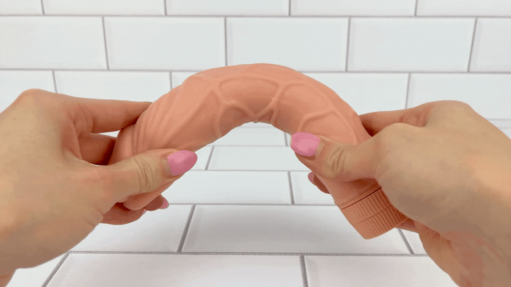 GIF Of 8 Inch Ultra Veined Vibrating Dildo shaft being bent to demonstrate its flexibility 