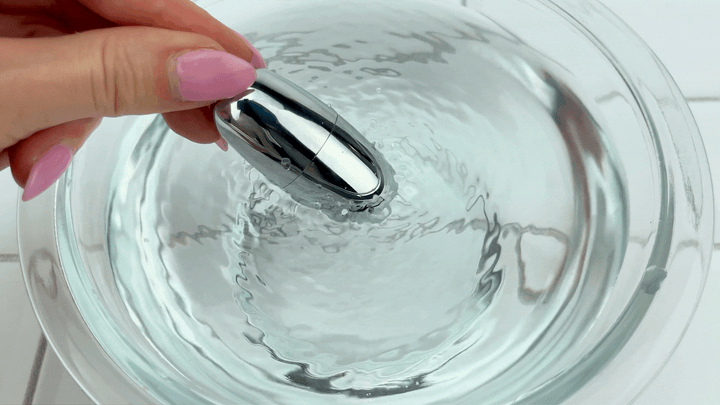 GIF of  Clit Bullet in bowl of water vibrating intensely 