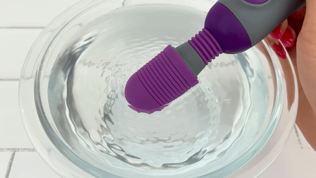 GIF of Mini Handheld Personal Wand Massager head vibrating in bowl of water 
