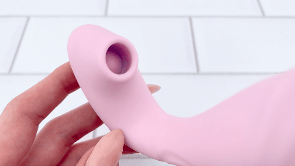 hands holding air pulse stimulator from Duo Desire Wearable Air Pulse Clit and G-Spot Vibrator  