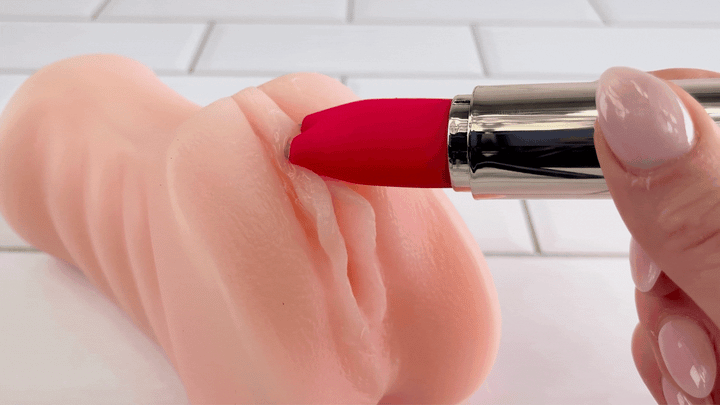 GIF of Electrostimulation Silicone Lipstick Vibe used on hood of clitoris from male masturbator 