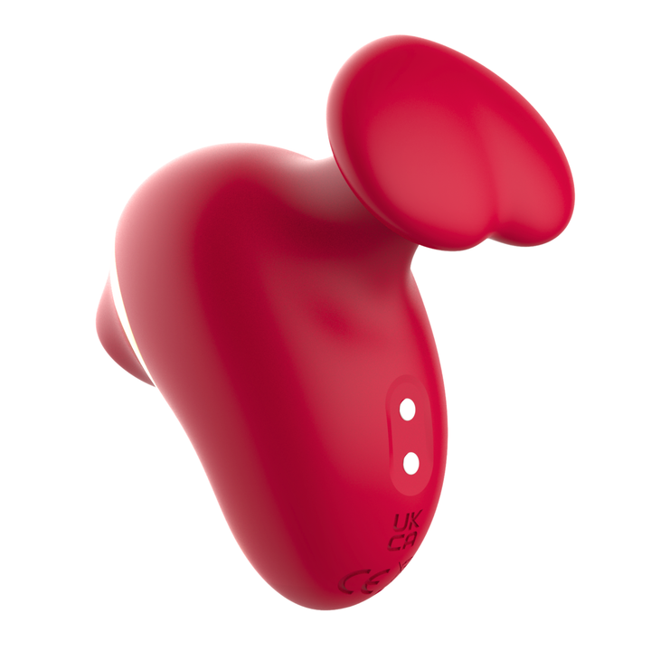 Image of red air pulse vibrator with finger hold showing charging port