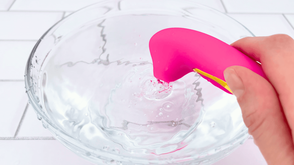 GIF of Dolce Silicone Air Pulsating Clit Stimulator vibrating in bowl of water 