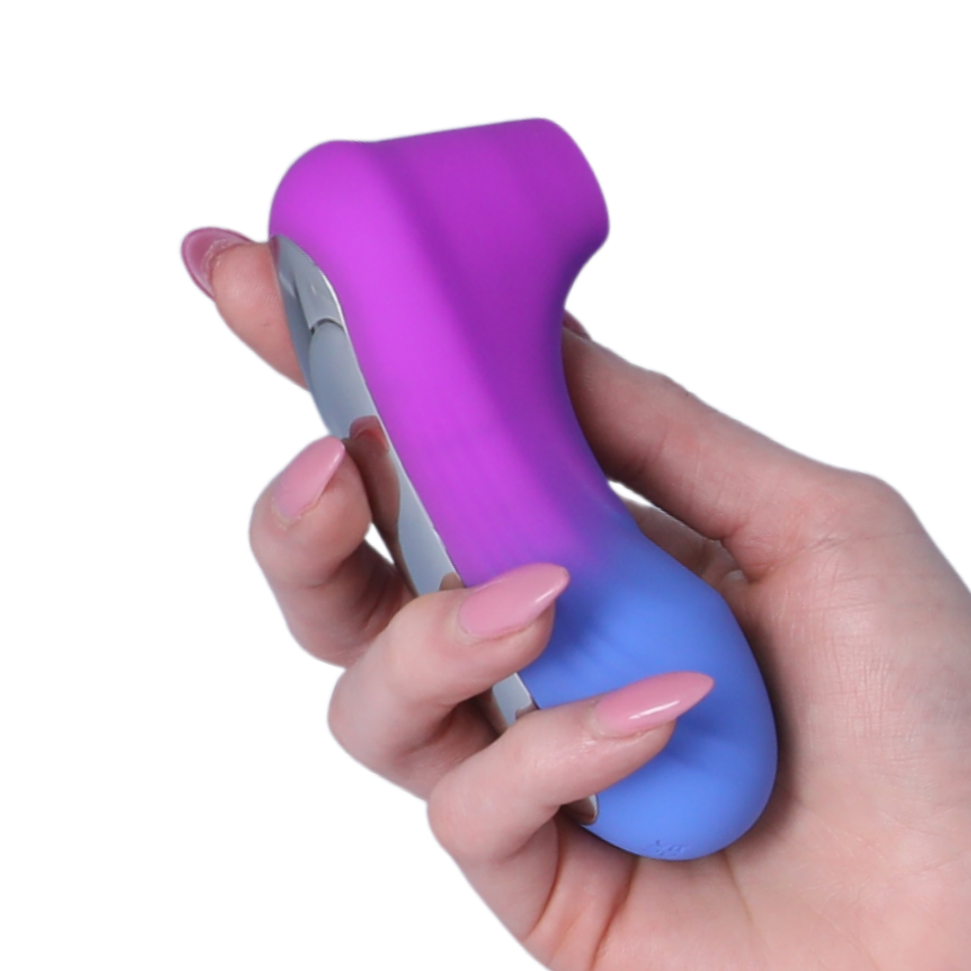 Hand holding a purple and blue electronic device on a white background