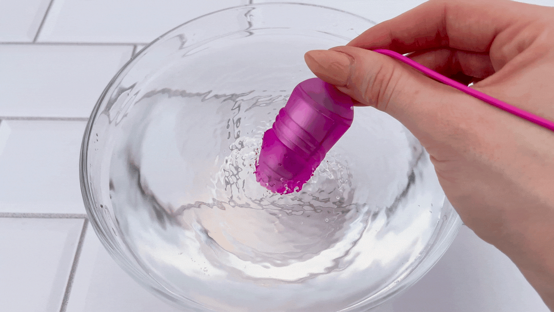 GIF of bullet vibrator used on bowl of water 