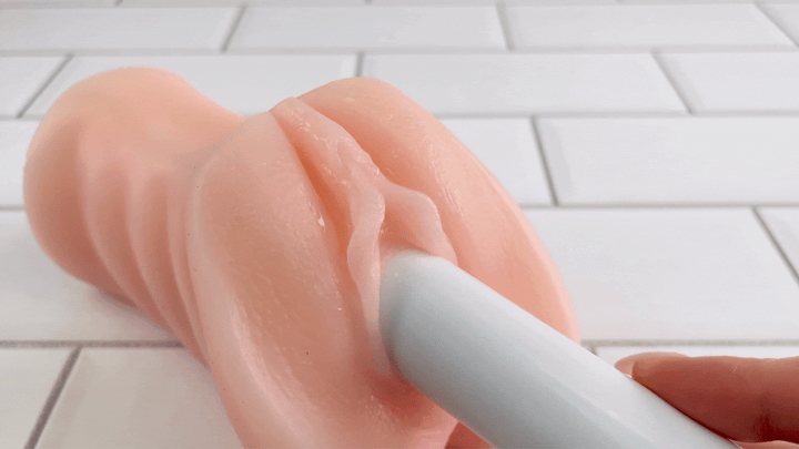 GIF of Premium Mini Power Bullet inside realistic male masturbator with super strong vibrations 