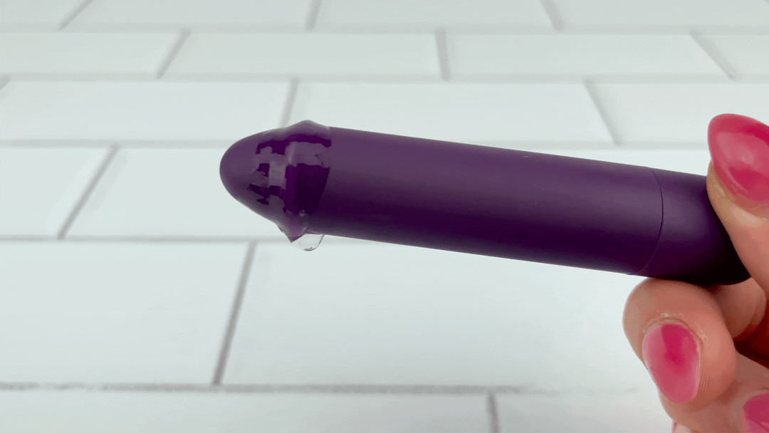 GVIF of  Rechargeable Pinpoint Bullet Vibrator with lube dripping off from intense vibrations 