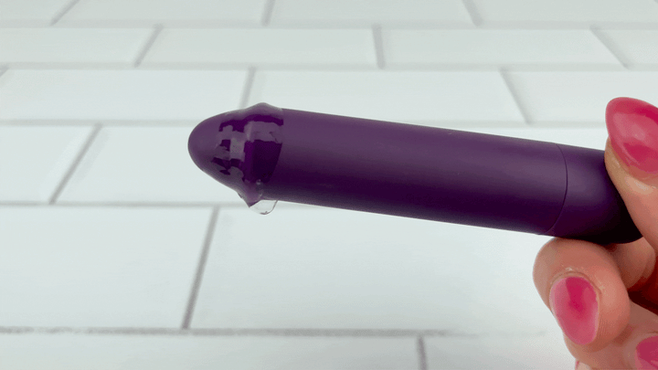 GVIF of  Rechargeable Pinpoint Bullet Vibrator with lube dripping off from intense vibrations 