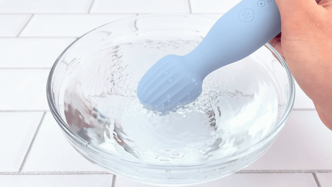 GIF of head from Mini Silicone Rechargeable Massage Wand vibrating in bowl of water NOT WATERPROOF 