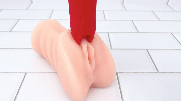 GIF of forked tip of red wand vibrating on male masturbator