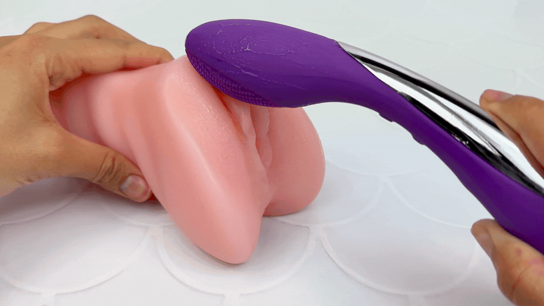 GIF of nubby end being used to massage model of a clitoris
