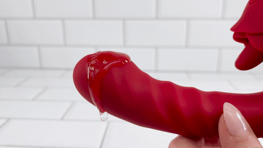 GIF of rose thrusting licking vibrator with lube vibrating on thruster tip 