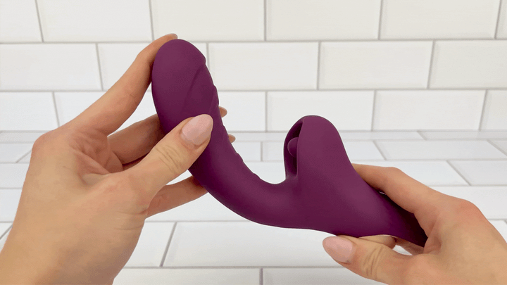 GIF of Licking Dual Action Vibrator shaft being bent to demonstrate it will adjust to any shape vagina 