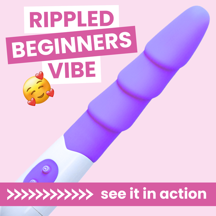 Purple and white riddled beginners vibe toy with text on a pink background