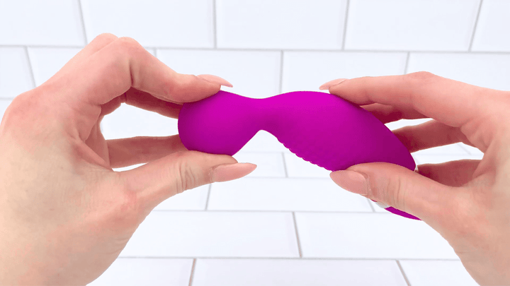 GIF of Duo Tease High Intensity Clit Sucker and Vibrator  bulbous tip being bent to show flexibility 