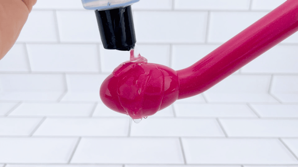 GIF of lube being poured onto vibrating Rose G-Spot Vibrator 