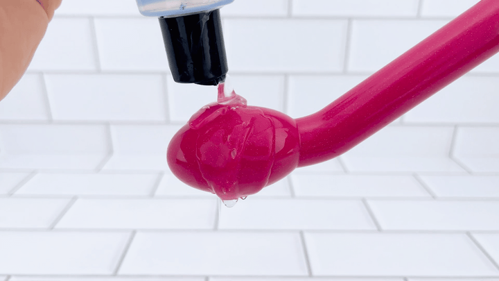 GIF of Rose G-Spot Vibrator with lubricant vibrating on tip 