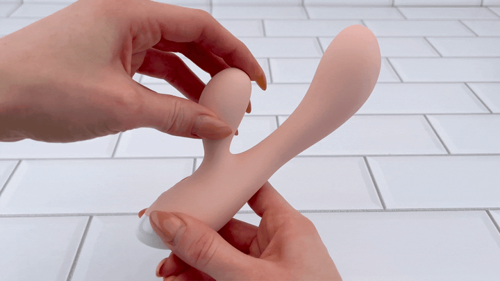 GIF of Waterproof Silicone Rechargeable Dual-Action Vibrator clitoral stimulator being bent to show flexibility 