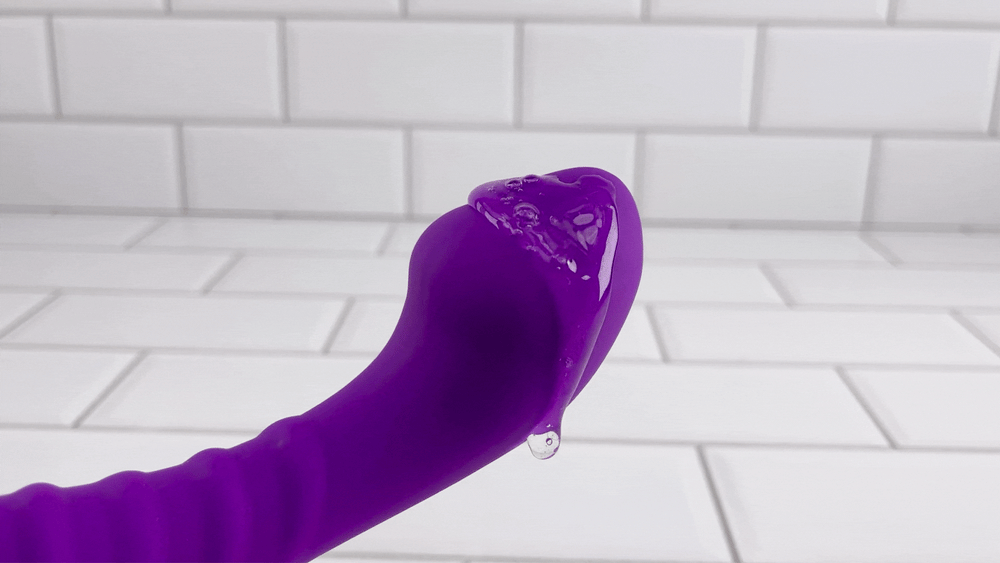 GIF of lube vibrating on top of Eli Silicone Personal G-Spot Massager 