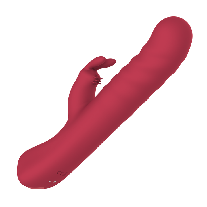 angled side view of Ribbed Thrusting Rabbit Vibrator magnetic charging