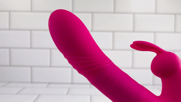 Thrusting pink waterproof rabbit vibrator GIF 