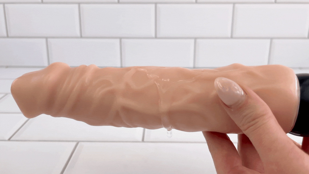 GIF of lubricant vibrating on top of 9 Inch Ultra Veined Vibrating Dildo 
