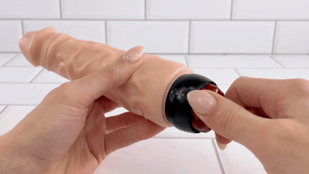 GIF of 9 Inch Ultra Veined Vibrating Dildo twist dial being turned to power on device 