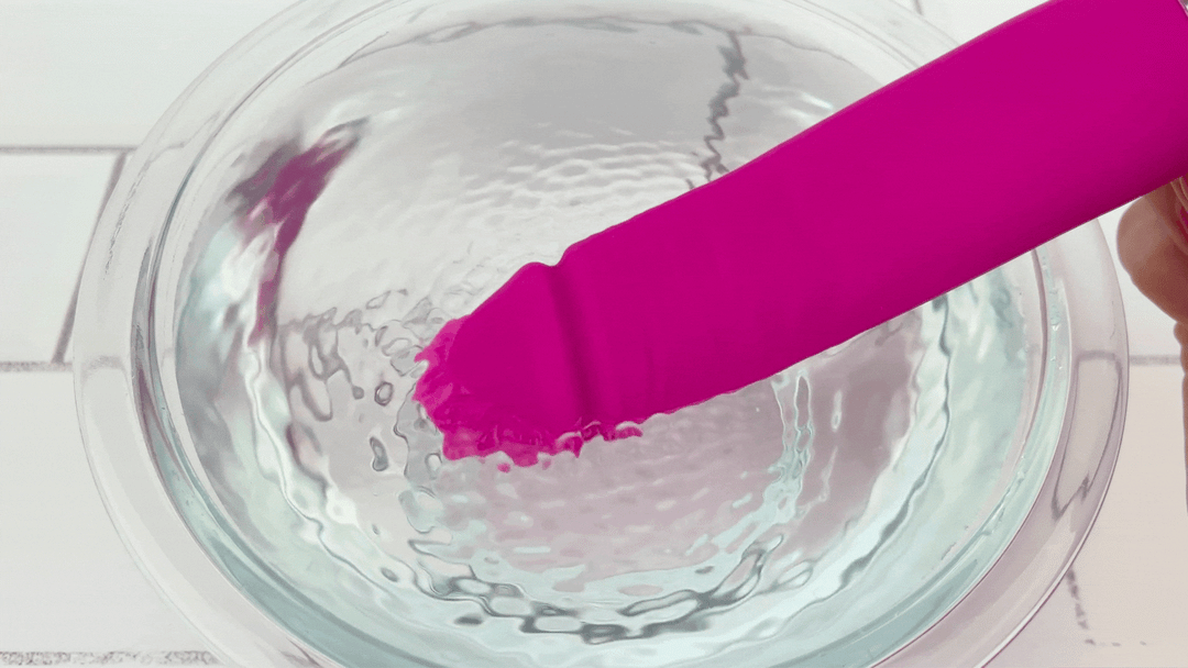 GIF of Silicone Rechargeable Realistic Vibrator tip vibrating in bowl of water 