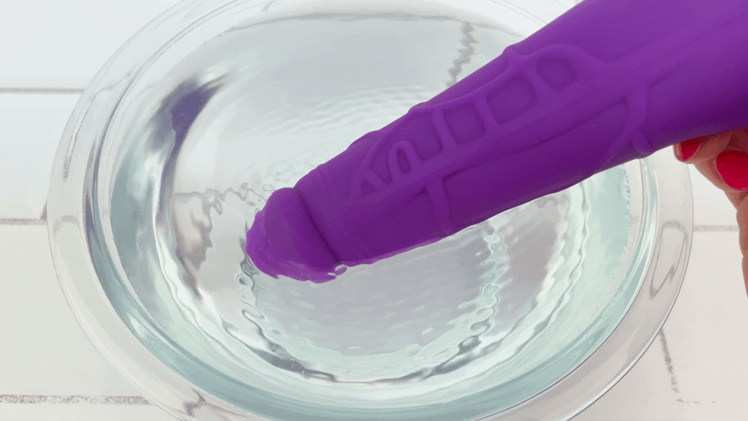 GIF of Silicone Vibrating Dildo with Realistic Penis Shape vibrating in bowl of water 