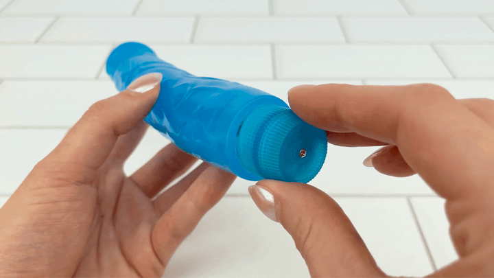GIF of Blue Multi-Speed Realistic Vibrator being powered on with twist dial 