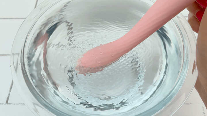 GIF of G-spot adult vibrator vibrating in bowl of water 