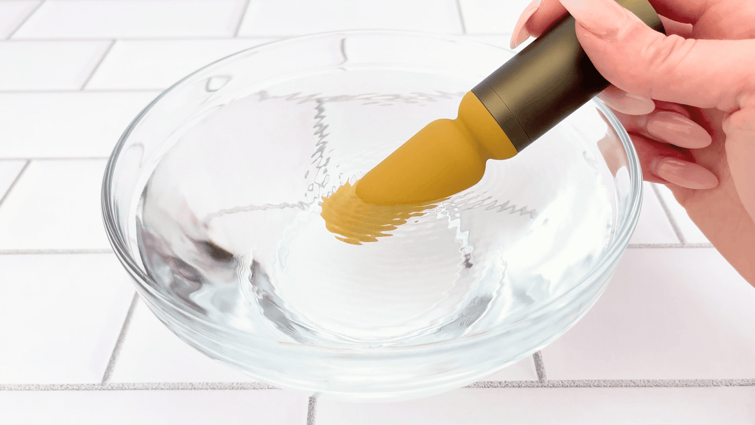 GIF of Luxury Slim Wand Vibrator vibrating in bowl of water
