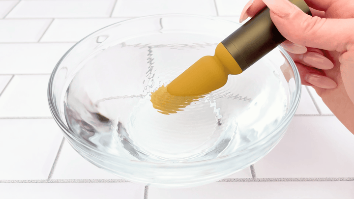 GIF of Luxury Slim Wand Vibrator vibrating in bowl of water