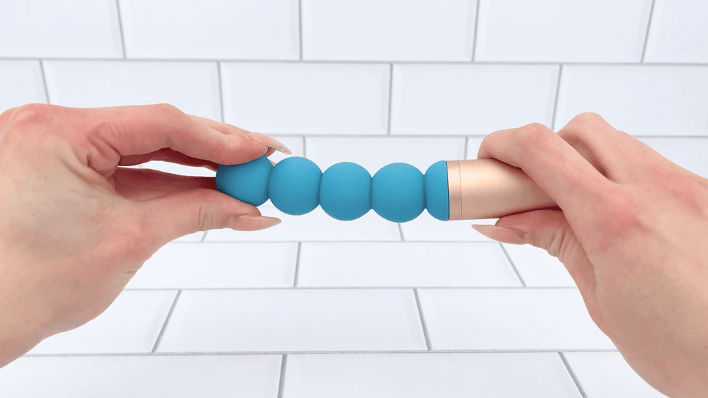 Luxury Beaded Wand Massager being bent to show flexibility 