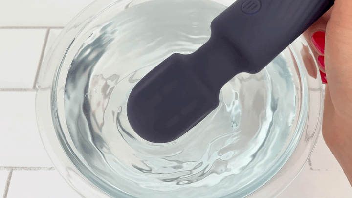 GIF of Jolie High-Power Silicone Wand Vibrator in Grey vibrating on lowest setting in a bowl of water 
