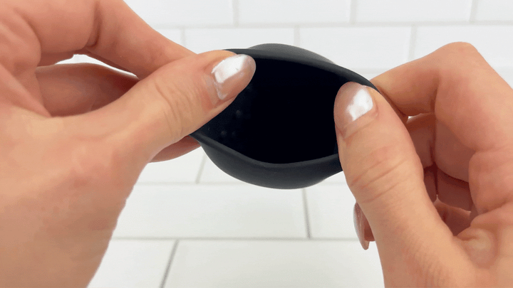 GIF of Vibrating Penis Tip Massager opening being stretched to show pleasure nubs 
