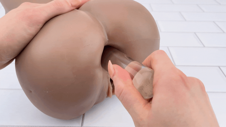 GIF of glass dildo sliding into anal entry of Brandi sex doll 