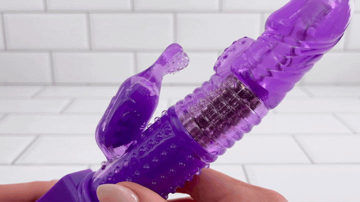 GIF of Ribbed Rotating Rabbit Vibe angled closeup shot of rabbit bunny head vibrating with ticklers 