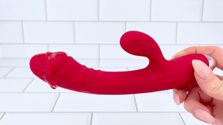 GIF of The Hop To It Rabbit Vibrator  full product view with lube on vibrating tip 