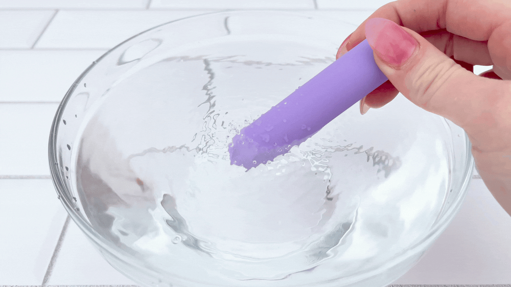 GIF of The Lavender Lover Bullet Vibe vibrating in bowl of water 