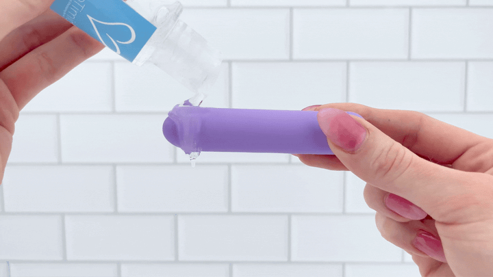 GIF of TooTimid tingling lube being poured into vibrating The Lavender Lover Bullet Vibe 