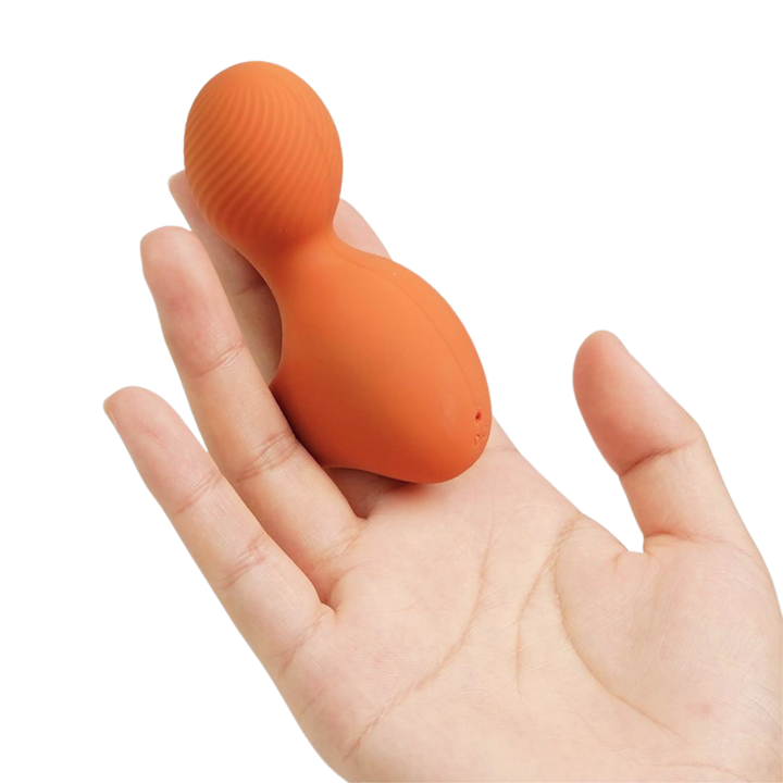 Finger Vibrator with bulbous tip on as seen worn on a hand 