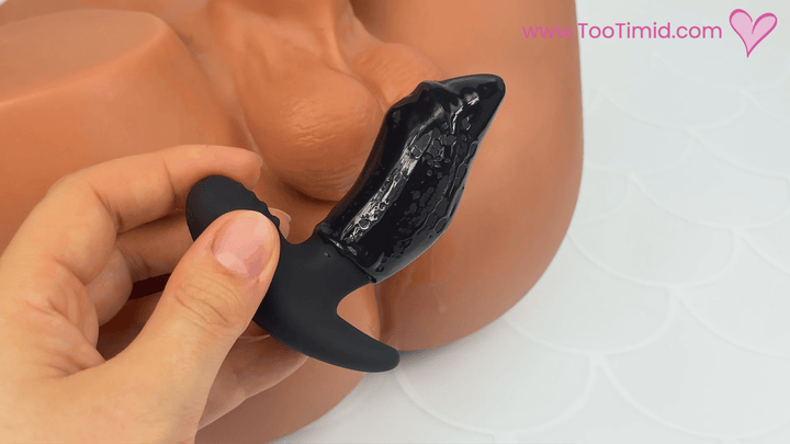 GIF of black fingering prostate massager in front of masturbator