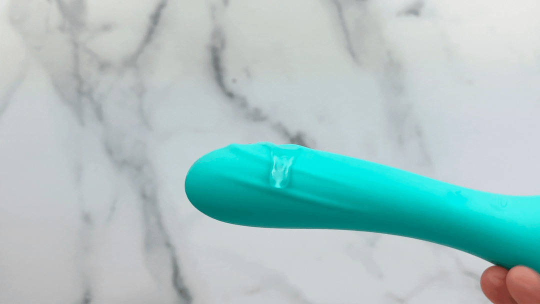 GIF of G-spot massager end covered in lube and vibrating