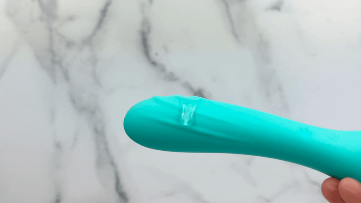 GIF of G-spot massager end covered in lube and vibrating