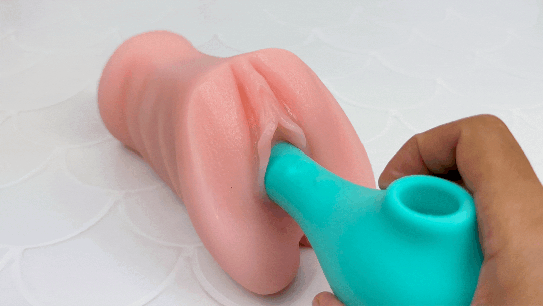 GIF of G-spot massager end inserted into a model of a vagina and vibrating