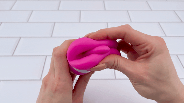 GIF of lips from Goodnight Kiss Clitoral Licker being squished together 