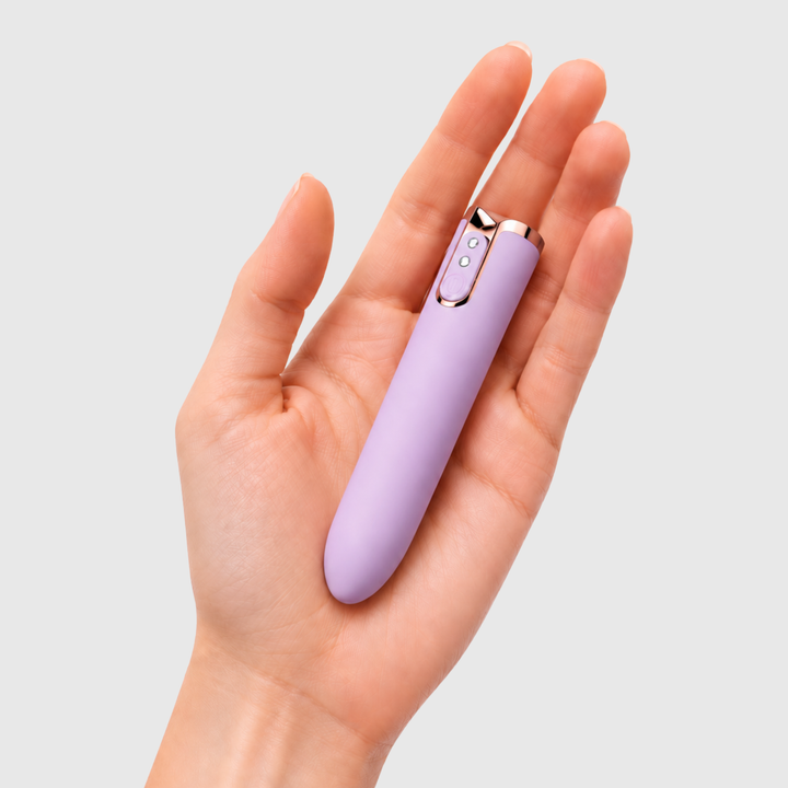hand holding Lavender Lipstick Bullet Vibrator 