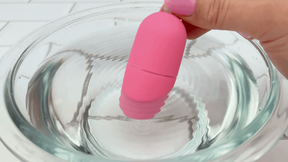 vibrating kegel egg powered on in bowl of water showing vibration ripples 