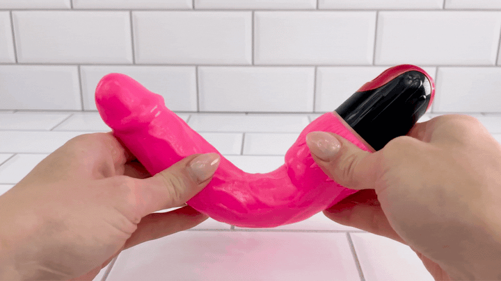 GIF of hot pink Ultra Veined Realistic Vibrating Dildo being bent to show flexibility 